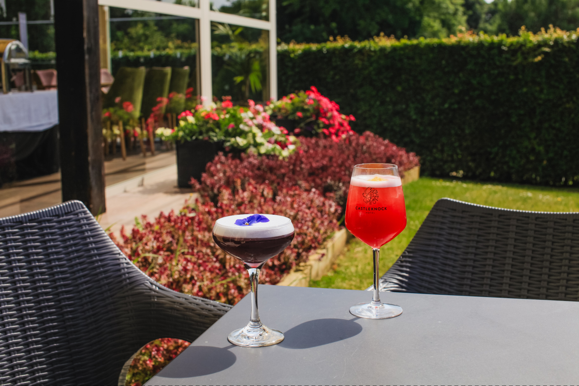 Colorful cocktails served in warm sunlit patio setting