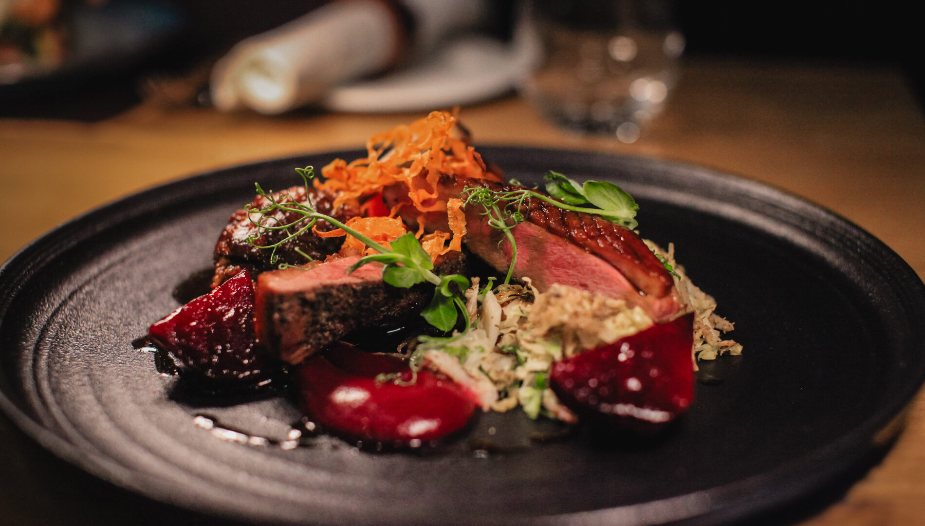 Elegant plated dish showcasing fine dining at Earth Vine