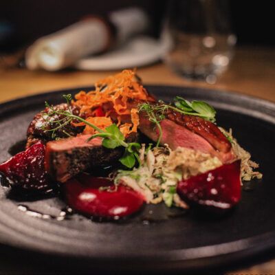 Elegant plated dish showcasing fine dining at Earth Vine