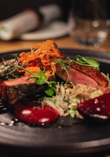 Elegant plated dish showcasing fine dining at Earth Vine