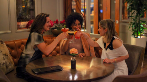 Group enjoying vibrant cocktails at Lime Tree Bar