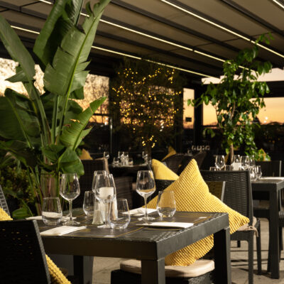 Warm sunset glow over 22 Bar Patio with cozy seating